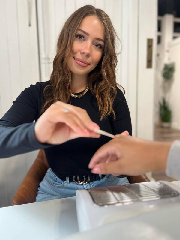 Yeva filing a clients nails