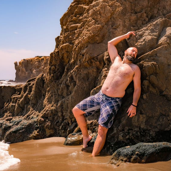 Man posing on the beach